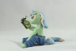 Size: 1280x854 | Tagged: safe, artist:azgchip, derpibooru import, lyra heartstrings, pony, unicorn, background pony, clothes, craft, female, flower, hand, image, jeans, jpeg, mare, mechanical hands, pants, photo, sculpture, sitting, solo, that pony sure does love hands, that pony sure does love humans, wax