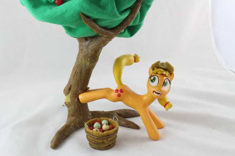 Size: 1280x854 | Tagged: safe, artist:azgchip, derpibooru import, applejack, earth pony, pony, accident, apple, applebucking, bucket, bucking, craft, faic, falling, female, food, funny, image, jpeg, mare, photo, scared, sculpture, shocked, solo, tree, wax, wide eyes