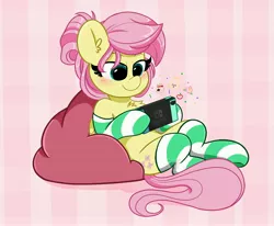 Size: 4096x3372 | Tagged: safe, artist:kittyrosie, derpibooru import, fluttershy, pegasus, pony, alternate hairstyle, blushing, chest fluff, clothes, cute, ear fluff, female, gamershy, hair bun, high res, image, isabelle (animal crossing), jpeg, mare, nintendo switch, playing, shyabetes, sitting, socks, striped socks