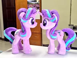 Size: 1024x768 | Tagged: safe, artist:nekokevin, derpibooru import, starlight glimmer, pony, unicorn, series:nekokevin's glimmy, duality, duo, female, image, irl, jpeg, looking at each other, mare, photo, plushie, self ponidox, similo duplexis, size difference, smiling, table