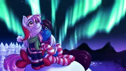 Size: 4000x2250 | Tagged: safe, artist:sugaryviolet, derpibooru import, oc, oc:altus bastion, oc:evening skies, unofficial characters only, pegasus, pony, unicorn, aurora borealis, blushing, christmas, clothes, commission, duo, duo female, female, giantess, glow, hat, holiday, horn, hug, image, macro, macro/micro, mare, night, pegasus oc, png, santa hat, scarf, smiling, snow, socks, stargazing, stockings, striped socks, sweater, thigh highs, tree, ugly sweater, unicorn oc, winghug, wings, wings down, winter, winter outfit