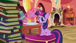 Size: 1280x720 | Tagged: safe, derpibooru import, screencap, twilight sparkle, pony, unicorn, spike at your service, book, cup, female, golden oaks library, image, library, mare, pillow, png, solo, teacup, teapot, unicorn twilight