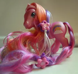 Size: 692x659 | Tagged: safe, derpibooru import, photographer:lilcricketnoise, rainbow flash, earth pony, pony, g3, image, jpeg, mane clip, palindrome get, smiling, solo, super long hair pony, tail clip, toy