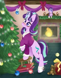 Size: 1621x2048 | Tagged: safe, artist:pineappleartz, derpibooru import, snowfall frost, starlight glimmer, pony, unicorn, christmas, christmas tree, clothes, decorating, doll, fireplace, glasses, glowing horn, hearth's warming doll, holiday, horn, image, jpeg, present, toy, tree