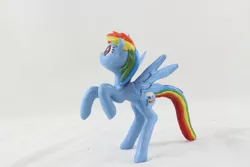 Size: 1280x854 | Tagged: safe, artist:azgchip, derpibooru import, rainbow dash, pegasus, pony, backwards cutie mark, craft, female, image, jpeg, mare, photo, rearing, sculpture, solo, spread wings, wax, wings