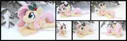 Size: 5340x1754 | Tagged: safe, artist:peruserofpieces, derpibooru import, fluttershy, pegasus, pony, beanie (plushie), cute, female, happy, holly, image, irl, looking at you, lying down, mare, photo, plushie, png, prone, shyabetes, smiling, smiling at you, snow, solo, sploot, tree, wings