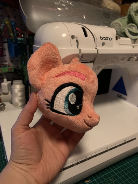 Size: 3024x4032 | Tagged: safe, artist:ketika, derpibooru import, sunny starscout, earth pony, pony, g5, head, image, irl, jpeg, photo, plushie, sewing machine, smiling, starry eyes, that was fast, wingding eyes