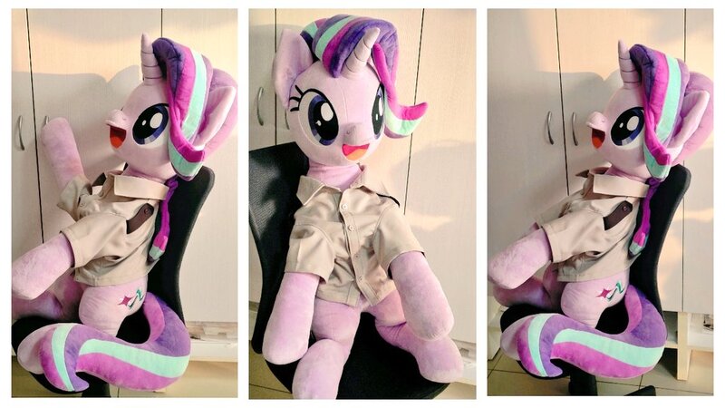 Size: 1024x576 | Tagged: safe, artist:nekokevin, derpibooru import, starlight glimmer, pony, unicorn, series:nekokevin's glimmy, clothes, female, image, irl, jpeg, life size, looking at you, mare, open mouth, photo, plushie, raised hoof, shirt, sitting, smiling, solo