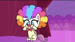 Size: 828x463 | Tagged: safe, derpibooru import, screencap, fluttershy, pegasus, my little pony: pony life, spoiler:pony life, spoiler:pony life s02e19, backstage, clown makeup, clown nose, clown wig, crowd, curtains, cute, flutterclown, image, jpeg, lolly-pop, shyabetes