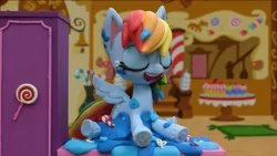 Size: 1920x1080 | Tagged: safe, derpibooru import, screencap, rainbow dash, pony, cake off, my little pony: stop motion short, cake, food, image, laughing, png, solo, stop motion