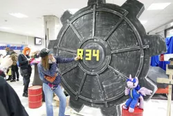 Size: 1600x1067 | Tagged: safe, derpibooru import, twilight sparkle, human, fallout equestria, 2021, cyrillic, image, irl, irl human, jpeg, newbronycon, photo, plushie, rubronycon, rule 34, russian, vault door