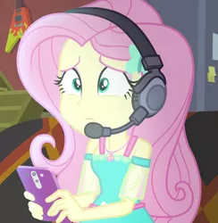 Size: 717x734 | Tagged: safe, derpibooru import, screencap, fluttershy, costume conundrum, equestria girls, equestria girls series, spoiler:eqg series (season 2), cropped, headphones, image, phone, png, solo