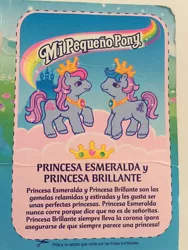 Size: 720x960 | Tagged: safe, derpibooru import, official, photographer:liselotte, earth pony, pony, backcard, castle, cloud, female, filly, g2, image, jewel (g2), jpeg, princess, royal twin baby ponies, siblings, spanish, sparkle (g2), text, translation request, twin baby ponies, twins