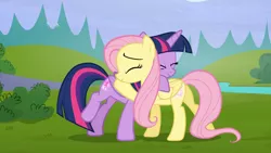 Size: 1920x1080 | Tagged: safe, derpibooru import, screencap, fluttershy, twilight sparkle, twilight sparkle (alicorn), alicorn, pegasus, pony, season 5, the hooffields and mccolts, ^^, cute, duo, duo female, eyes closed, female, glowing cutie mark, hug, image, mare, png, shyabetes, smiling, twiabetes