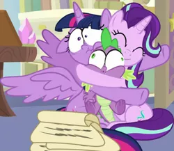 Size: 973x846 | Tagged: safe, derpibooru import, screencap, spike, starlight glimmer, twilight sparkle, twilight sparkle (alicorn), alicorn, dragon, pony, unicorn, a horse shoe-in, bulging eyes, cropped, eye bulging, eyes closed, faic, female, hug, image, male, mare, png, scroll, smiling, spread wings, squeezing, starlight's office, wide eyes, winged spike, wings