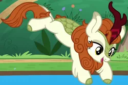 Size: 1116x739 | Tagged: safe, derpibooru import, screencap, autumn blaze, kirin, sounds of silence, awwtumn blaze, cropped, cute, diving, female, image, jumping, png, smiling, solo, water