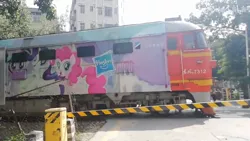 Size: 1280x720 | Tagged: safe, derpibooru import, pinkie pie, rarity, twilight sparkle, twilight sparkle (alicorn), alicorn, earth pony, pony, unicorn, barrier, diesel locomotive, female, hasbro logo, image, irl, locomotive, mare, photo, png, train, tree