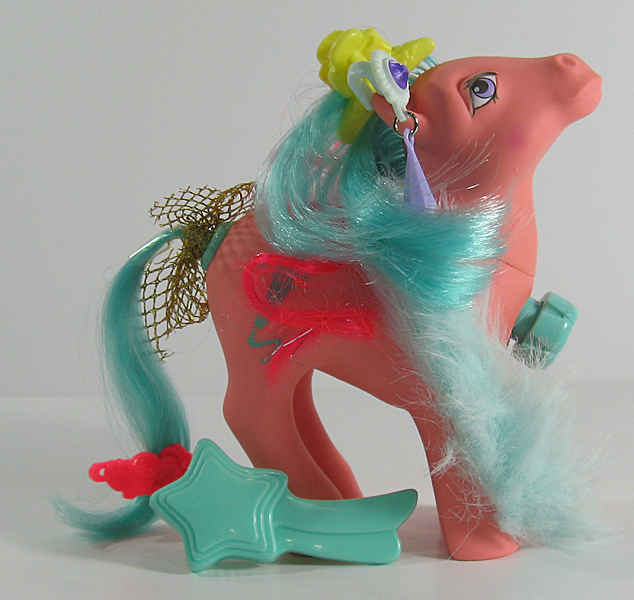 Size: 634x600 | Tagged: safe, derpibooru import, photographer:breyer600, songster, barrette, bow, comb, dance 'n prance pony, ear piercing, earring, feather boa, g1, image, jewelry, jpeg, piercing, simple background, tail bow, toy