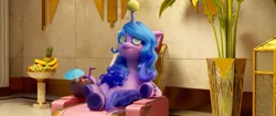 Size: 2048x858 | Tagged: safe, derpibooru import, screencap, izzy moonbow, pony, unicorn, spoiler:g5, armchair, ball, banana, coconut, female, food, fruit bowl, g5, grapes, hornball, image, izzy's tennis ball, leaves, lying down, mare, pineapple, png, solo, spa, tennis ball, vase