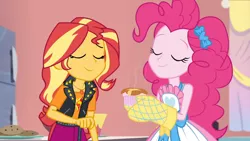 Size: 3410x1920 | Tagged: safe, derpibooru import, screencap, pinkie pie, sunset shimmer, equestria girls, equestria girls series, holidays unwrapped, spoiler:eqg series (season 2), apron, clothes, eyes closed, female, food, geode of empathy, image, jacket, jewelry, jpeg, leather, leather jacket, magical geodes, necklace, saving pinkie's pie, smiling, souffle, tanktop
