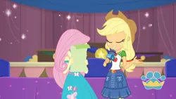 Size: 3410x1920 | Tagged: safe, derpibooru import, screencap, applejack, fluttershy, best in show: the pre-show, equestria girls, equestria girls series, spoiler:eqg series (season 2), applejack's hat, belt, best in show logo, clothes, cowboy hat, cutie mark, cutie mark on clothes, denim skirt, eyes closed, female, geode of super strength, hat, image, jewelry, jpeg, magical geodes, microphone, necklace, skirt, smiling