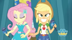 Size: 3410x1920 | Tagged: safe, derpibooru import, screencap, applejack, fluttershy, best in show: the pre-show, equestria girls, equestria girls series, spoiler:eqg series (season 2), applejack's hat, belt, best in show logo, clothes, cowboy hat, cutie mark, cutie mark on clothes, denim skirt, eyes closed, female, geode of fauna, geode of super strength, grin, hairpin, hat, image, jewelry, jpeg, magical geodes, microphone, necklace, skirt, smiling
