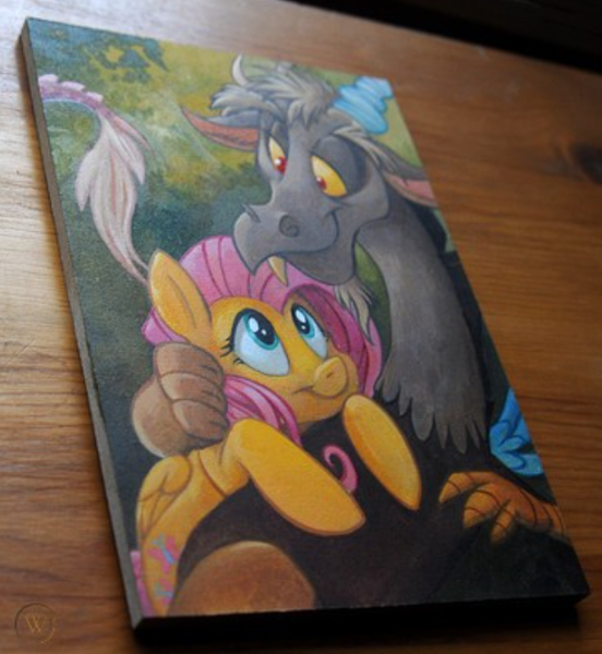 Size: 659x716 | Tagged: safe, artist:kenket, artist:spainfischer, derpibooru import, discord, fluttershy, draconequus, pegasus, pony, acrylic painting, female, handmade, hug, hugging a pony, image, irl, irl photo, looking at each other, male, mare, painting, photo, png, scenery, selling, smiling, smiling at each other, snuggling, traditional art, wood