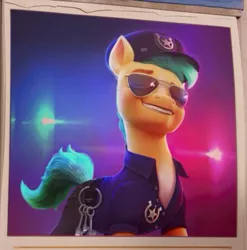 Size: 375x379 | Tagged: safe, derpibooru import, screencap, hitch trailblazer, earth pony, pony, my little pony: a new generation, spoiler:my little pony: a new generation, calendar, clothes, g5, grin, hat, image, jpeg, key, male, markings, pants, police, police hat, police officer, police uniform, shirt, smiling, solo, stallion, stupid sexy hitch trailblazer, sunglasses