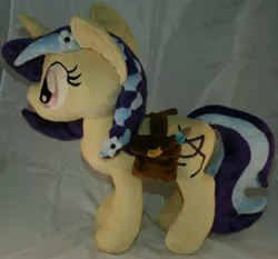 Size: 2356x2200 | Tagged: safe, artist:bastler, derpibooru import, oc, oc:cinnamon string, unofficial characters only, pony, unicorn, bag, female, flower, flower in hair, horn, image, irl, jpeg, mare, pencil, photo, plushie, saddle bag, unicorn oc