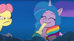 Size: 1674x938 | Tagged: safe, derpibooru import, screencap, izzy moonbow, posey (g5), pony, unicorn, my little pony: tell your tale, spoiler:g5, spoiler:my little pony: tell your tale, spoiler:tyts01e31, amalgamation, clothes, coat markings, costume, cute, eating, eyes closed, fake wings, food, g5, halloween, halloween costume, haunted house (episode), holiday, hoof polish, image, implied hitch trailblazer, implied pipp petals, implied sunny starscout, izzybetes, nightmare night costume, pasta, png, posey can't catch a break, slurp, smiling, socks (coat marking), solo, spaghetti