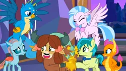 Size: 1600x900 | Tagged: safe, derpibooru import, screencap, gallus, ocellus, sandbar, silverstream, smolder, yona, changedling, changeling, classical hippogriff, dragon, earth pony, gryphon, hippogriff, pony, yak, she's all yak, bow, bowtie, dragoness, eyes closed, female, hair bow, hand on hip, image, jewelry, male, monkey swings, necklace, png, spread wings, student six, wings