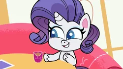 Size: 1192x670 | Tagged: safe, derpibooru import, screencap, rarity, pony, unicorn, my little pony: pony life, spoiler:pony life s02e13, cup, female, image, jpeg, magical mare-story tour, mare, solo, sugarcube corner, teacup