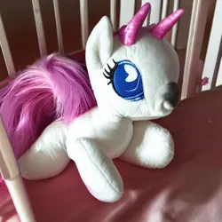 Size: 512x512 | Tagged: safe, derpibooru import, machine learning generated, stable diffusion, bicorn, pony, crib, foal, horn, image, jpeg, multiple horns, photo, plushie