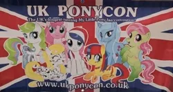 Size: 798x425 | Tagged: artist needed, safe, derpibooru import, pinkie pie, oc, oc:britannia (uk ponycon), earth pony, pony, unicorn, art pony, banner, cleopatra pony, dandelion pony, female, g3, g3 to g4, g4, generation leap, group, image, irl, jpeg, lowres, mare, my little pony fair, peacock pony, photo, ponycon, poster, sunny grace, uk ponycon