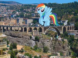 Size: 800x600 | Tagged: safe, artist:alandssparkle, derpibooru import, edit, rainbow dash, pegasus, pony, algeria, bridge, city, constantine (algeria), giant pony, image, irl, jpeg, macro, photo, ponies in real life