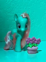 Size: 3024x4032 | Tagged: safe, derpibooru import, minty, a very minty christmas, accessories, best pony, brushable, figurine, flower, flower pot, g3, goddess, hair, image, jpeg, photo, picture, simple background, teal background, toy