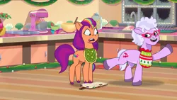 Size: 3072x1727 | Tagged: safe, derpibooru import, screencap, sunny starscout, earth pony, pony, my little pony: tell your tale, spoiler:g5, spoiler:my little pony: tell your tale, spoiler:tyts01e38, duo, duo female, female, foal food, g5, glasses, grandma figgy, high res, image, jpeg, mare, open mouth, open smile, smiling, youtube link