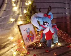 Size: 1949x1536 | Tagged: safe, artist:doctorkoda, artist:jewellier, derpibooru import, photographer:jewellier, trixie, deer, deer pony, original species, pony, unicorn, antlers, chocolate, christmas, christmas costume, christmas lights, christmas tree, food, holiday, image, irl, jpeg, photo, photo frame, plushie, reindeer antlers, ribbon, tinsel, traditional art, tree