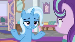 Size: 1764x993 | Tagged: safe, derpibooru import, screencap, starlight glimmer, trixie, pony, unicorn, a horse shoe-in, duo, duo female, female, frown, grin, image, lidded eyes, looking at each other, looking at someone, mare, png, shrug, smiling
