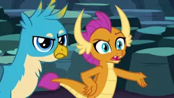 Size: 1280x720 | Tagged: safe, derpibooru import, screencap, gallus, smolder, dragon, gryphon, uprooted, dragoness, female, gallus is not amused, hand on hip, image, male, png, smolder is not amused, unamused