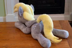 Size: 1280x854 | Tagged: safe, artist:azgchip, derpibooru import, derpy hooves, pegasus, pony, commission, dock, female, image, jpeg, lying down, mare, plushie, rear view, solo, tail