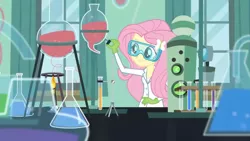 Size: 3410x1920 | Tagged: safe, derpibooru import, screencap, fluttershy, acadeca, equestria girls, friendship games, chemicals, chemistry, female, flask, gloves, hairpin, high res, image, jpeg, rubber gloves, science, scientist, smiling, solo