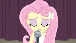 Size: 3410x1920 | Tagged: safe, derpibooru import, screencap, fluttershy, acadeca, equestria girls, friendship games, eyes closed, female, hairpin, high res, image, jpeg, microphone, solo