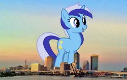 Size: 2000x1260 | Tagged: safe, artist:90sigma, artist:thegiantponyfan, derpibooru import, minuette, pony, unicorn, female, florida, giant pony, giant unicorn, giantess, highrise ponies, image, irl, jacksonville, macro, mare, mega giant, mega/giant minuette, multicolored mane, multicolored tail, open mouth, open smile, photo, png, ponies in real life, smiling, tail