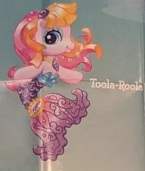 Size: 242x286 | Tagged: safe, derpibooru import, official, toola roola, earth pony, merpony, pony, bangs, blue eyeshadow, eyeshadow, fish tail, g3, g3.5, image, jewelry, jpeg, low quality, lowres, makeup, mermaid tail, name tag, necklace, official art, paintbrush, solo, tail