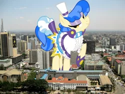 Size: 2048x1534 | Tagged: safe, artist:dashiesparkle, artist:thegiantponyfan, derpibooru import, sapphire shores, earth pony, pony, female, giant pony, giant sapphire shores, giant/macro earth pony, giantess, highrise ponies, image, irl, kenya, looking at you, macro, mare, mega giant, nairobi, photo, png, ponies in real life, raised hoof, smiling, solo