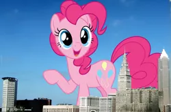 Size: 1347x884 | Tagged: safe, artist:dashiesparkle, artist:thegiantponyfan, derpibooru import, pinkie pie, earth pony, pony, cleveland, female, giant pinkie pie, giant pony, giant/macro earth pony, giantess, highrise ponies, image, irl, looking at you, macro, mare, mega giant, ohio, open mouth, open smile, photo, png, ponies in real life, raised hoof, smiling