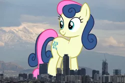 Size: 1280x848 | Tagged: safe, artist:cloudyglow, artist:thegiantponyfan, bon bon, sweetie drops, earth pony, pony, background pony, female, giant bon bon (sweetie drops), giant pony, giant/macro earth pony, giantess, highrise ponies, image, irl, looking back, macro, mare, mega bon bon, mega giant, mexico, mexico city, photo, png, ponies in real life, smiling, standing