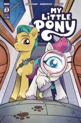 Size: 1318x2000 | Tagged: safe, artist:justasuta, derpibooru import, idw, official, hitch trailblazer, zipp storm, earth pony, pegasus, pony, my little pony: a new generation, spoiler:comic, spoiler:g5, spoiler:g5comic, spoiler:g5comic03, comic cover, cover, female, g5, image, magnifying glass, male, official comic, paw prints, png, spoilers in the description