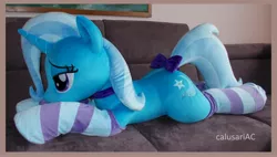 Size: 3952x2248 | Tagged: safe, artist:calusariac, derpibooru import, trixie, pony, bow, clothes, image, irl, jpeg, life size, lying down, photo, plushie, prone, socks, solo, striped socks, tail, tail bow